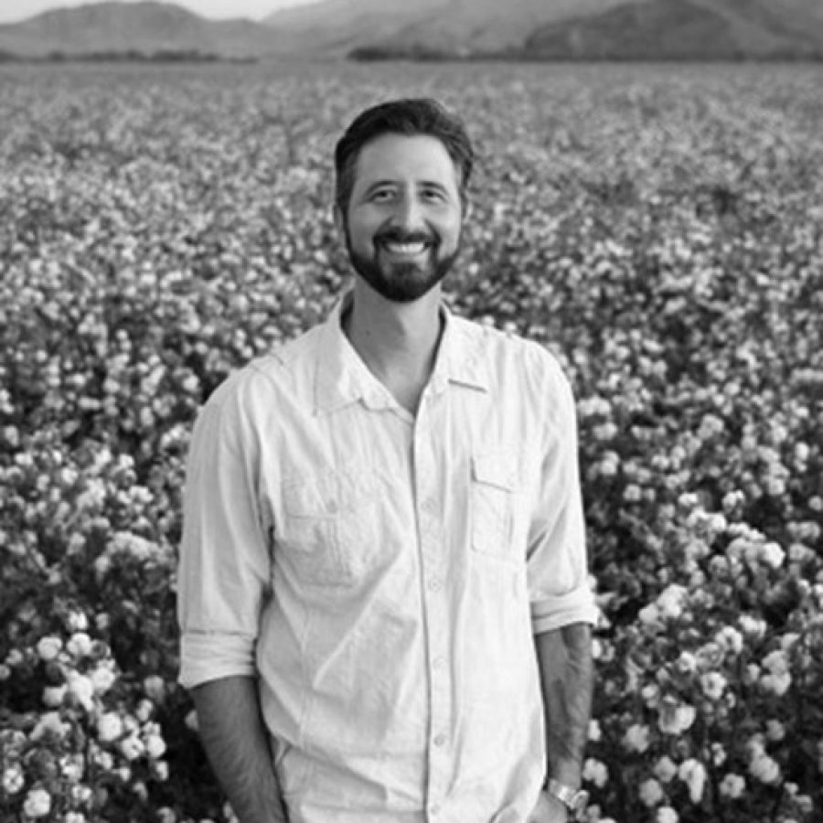 Photograph of Kam Mickolio in Field